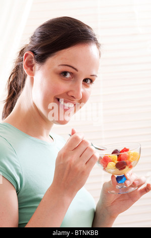teeen eating bowl op fruits Stock Photo
