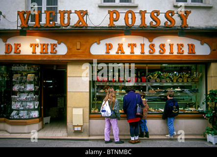 French people person mother and children window shopping at teahouse salon de the patissier town of Poissy France Europe Stock Photo