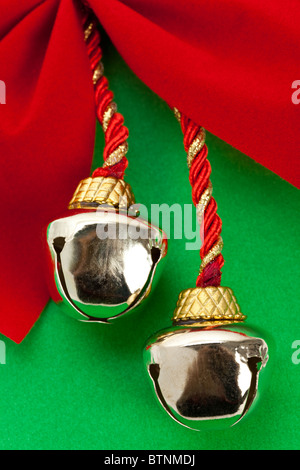 Christmas Bells and ribbon with green background