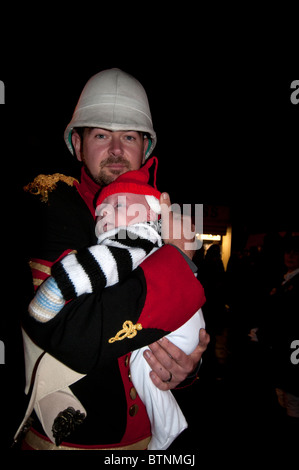 November 5th 2010. Fireworks and bonfire night, Lewes , Sussex. Father and baby Stock Photo