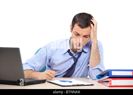 A desperate businessman in the office looking down Stock Photo
