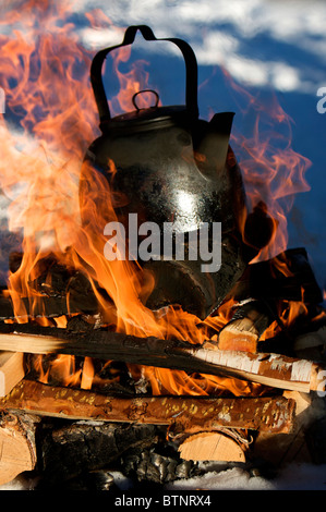 coffee pot boiling over an open fire cowboy flame smoke caffine wild west  Stock Photo - Alamy