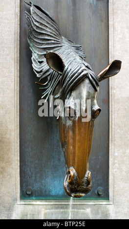 Horse's head bronze sculptured water fountain, Bruges, Belgium, Europe Stock Photo