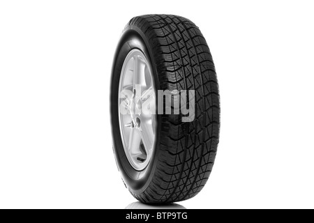 Photo of a car tyre (tire) on a five spoke alloy wheel isolated on a white background Stock Photo