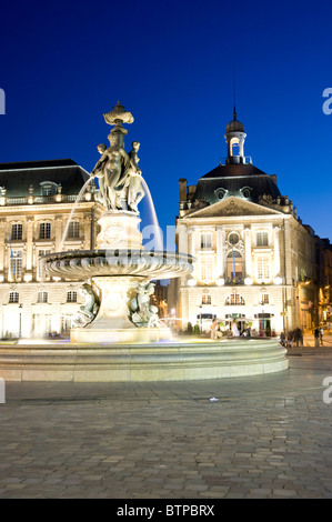 Three Graces Fountain, Place de la Bourse, Dusk, Bordeaux, Gironde, France Stock Photo
