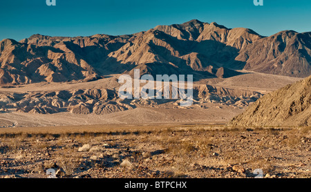 Mojave Desert and Owlshead Mts over Confidence Hills sunrise from Harry Wade Road in Death Valley National Park, California, USA Stock Photo