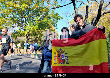 NY, NY - Nov 7: Family father children display Spanish flag cheer watch runners in 2010 New York City Marathon in Central Park. Stock Photo