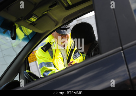 traffic officer questions driver Stock Photo