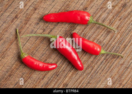 red hot peppers on wooden background Stock Photo