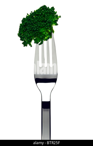boiled broccoli sticking on a fork, cutout Stock Photo