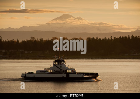 The Lummi Island ferry, 'Whatcom Chief', makes it's way across Hales Pass in Puget Sound, with Mt. Baker in the background.