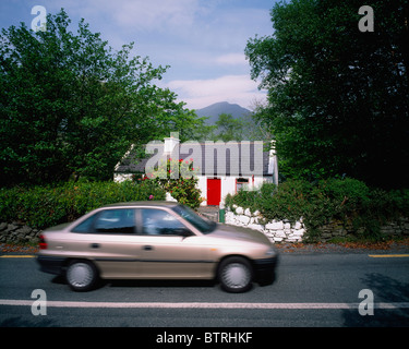 Leenane, Co Galway, Ireland; Car In Front Of A Cottage Stock Photo