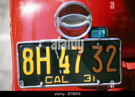 license plate classic antique auto car Buick roadster restore rebuild refurbish renew old red California 1931 Stock Photo