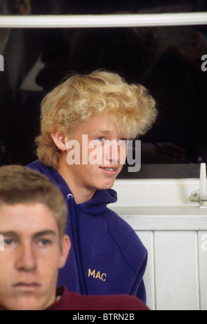 Blond bushy hair teen male boy student portrait face smile happy pleasant freckle surfer school class listen Stock Photo