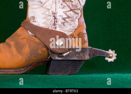 A well worn pair of cowboy boots with spurs. Stock Photo