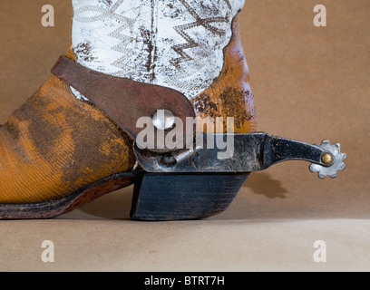 A well worn pair of cowboy boots with spurs. Stock Photo