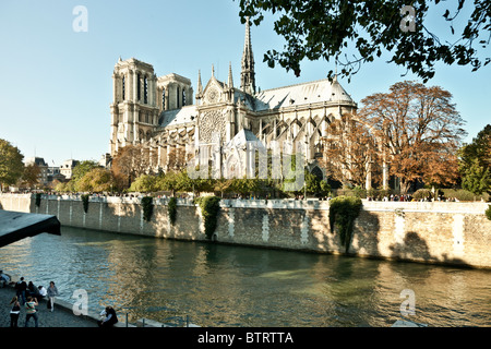 south side Notre Dame de Paris shows cathedral intact before 2019 fire with great 13 C. rose window of transept & flying buttresses above River Seine Stock Photo