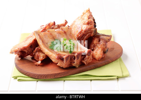 Oven-roasted pork ribs on a cutting board Stock Photo