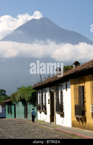 Street in Antigua, Guatemala, with Agua Volcano in background. Antigua is a UNESCO World heritage site. Stock Photo