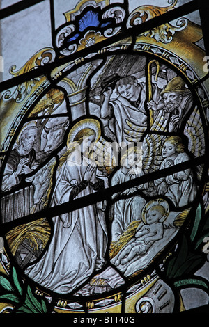 Stained glass window by Frederick Charles Eden depicting the Adoration of the Shepherds; Church of St Peter & St Paul, Longbridge Deverill, Wiltshire Stock Photo
