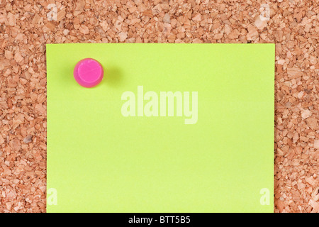 Light green blank note on the corkboard. Stock Photo