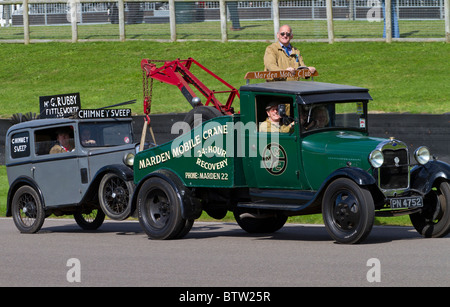 1929 Ford Model A tow truck with an Austin 7. 2010 Goodwood Revival, Sussex, England, UK. Stock Photo