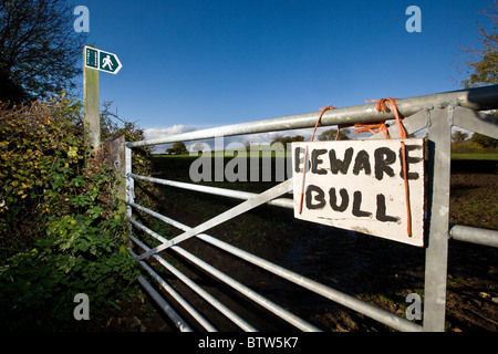 7.11.2010 Beware Of The Bull Sign Hanging On A Field Gate Next To A Public Footpath Stock Photo