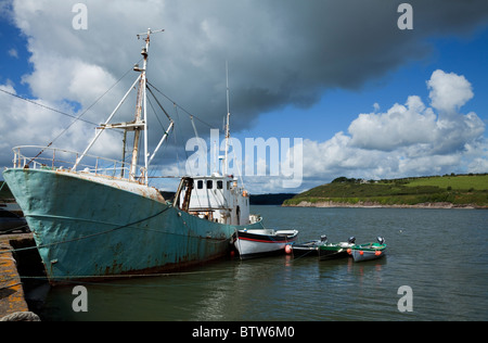 Four Colourful Local Irish Fishing Boats moored up at low tide in Fethard  Harbour in County Wexford, Southern Ireland Stock Photo - Alamy