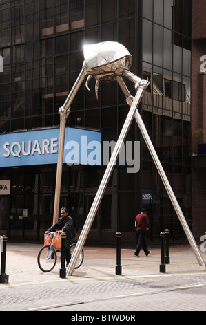 Woking commemorates writer H G Wells with a statue of a Martian fighting machine in the town centre. Stock Photo