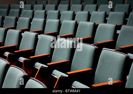 Rows of unoccupied seats in an empty auditorium or lecture hall Stock Photo