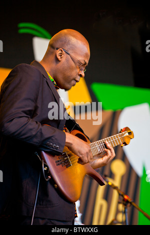 LIONEL LOUEKE plays guitar for ANGELIQUE KIDJO sings on the Jimmy Lyons Stage - 2010 MONTEREY JAZZ FESTIVAL, CALIFORNIA Stock Photo