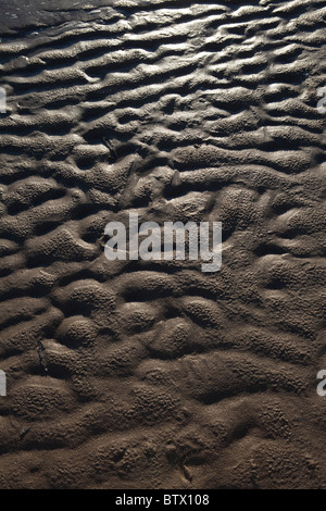 Ripples in sand on beach after tide has gone out Stock Photo