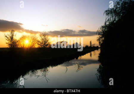 Winter Lincolnshire Fenland near Crowland river Welland sunset silhouette sunsets silhouettes English rivers England UK Stock Photo