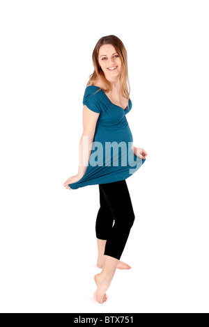 Cheerful happy young pregnant woman posing on white background. Stock Photo