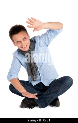 man sitting with crossed legs isolated on white Stock Photo - Alamy