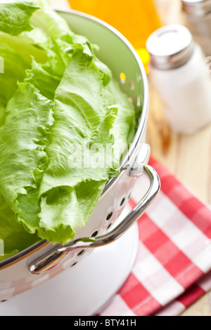 green lettuce in colander Stock Photo