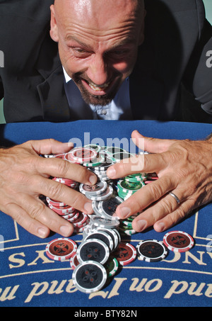 A man winning at gambling Stock Photo
