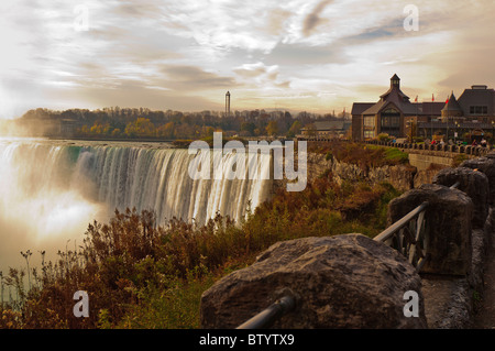 A view of Niagara Falls at sunrise with Table Rock Center in the background,Niagara Falls, Ontario,Canada Stock Photo