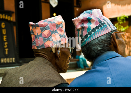 Nepali men wearing their traditional Nepali hats. Stock Photo