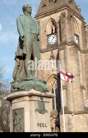 Statue of Sir Robert Peel 1778-1850,Market Place in his home town of Bury.St Mary the Virgin Church,Church of England. Stock Photo