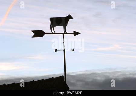 A weather vane with a cow Stock Photo