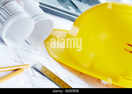 Construction blueprints with tools and helmet closeup Stock Photo - Alamy