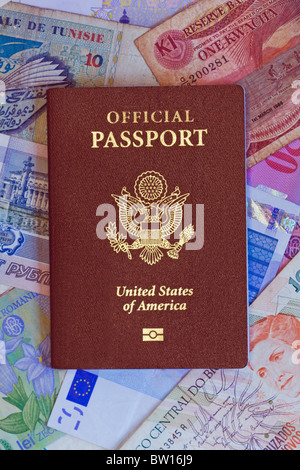 Official Government passport of the United States of America on a bed of international currency vertical Stock Photo