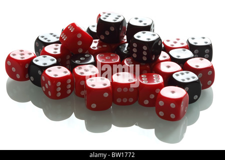 Several black and white dice on a white miror background. Shallow DOF. Stock Photo