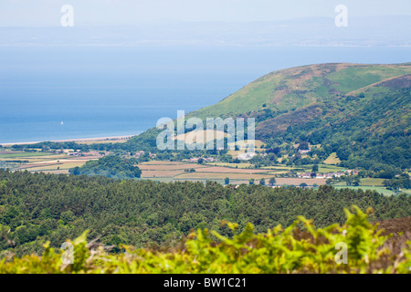 A telephoto view of Porlock Bay, the Exmoor village of Bossington and Bossington Hill from Dunkery Hill, Somerset Stock Photo
