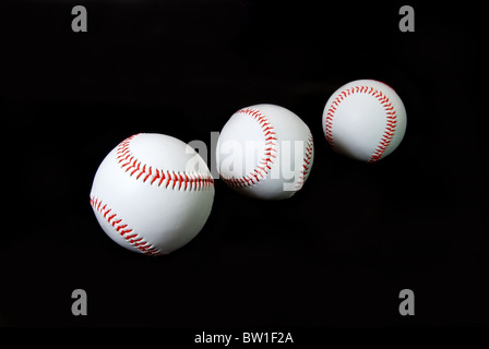 Three baseballs isolated on black background. Stock Photo