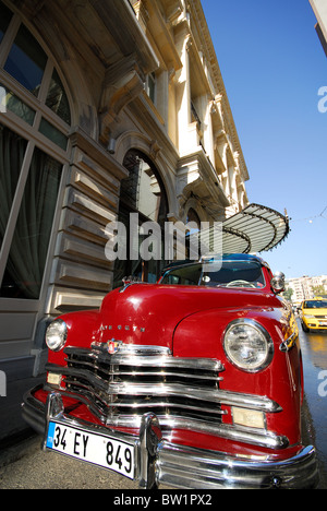 ISTANBUL, TURKEY. A classic Plymouth automobile parked outside the entrance to the Pera Palas Hotel in Beyoglu district. 2010. Stock Photo