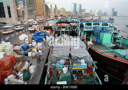 Unloading a boat in the port on the Dubai Creek, United Arab Emirates Stock Photo