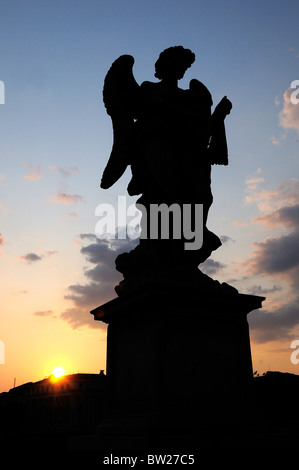 Silhouette of angel statue on Ponte Sant'Angelo at sunset Stock Photo