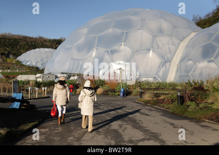 oriental visitors Exterior view of the Eden Project Biomes Cornish gardens St Austell Cornwall UK Autumn to Winter Stock Photo